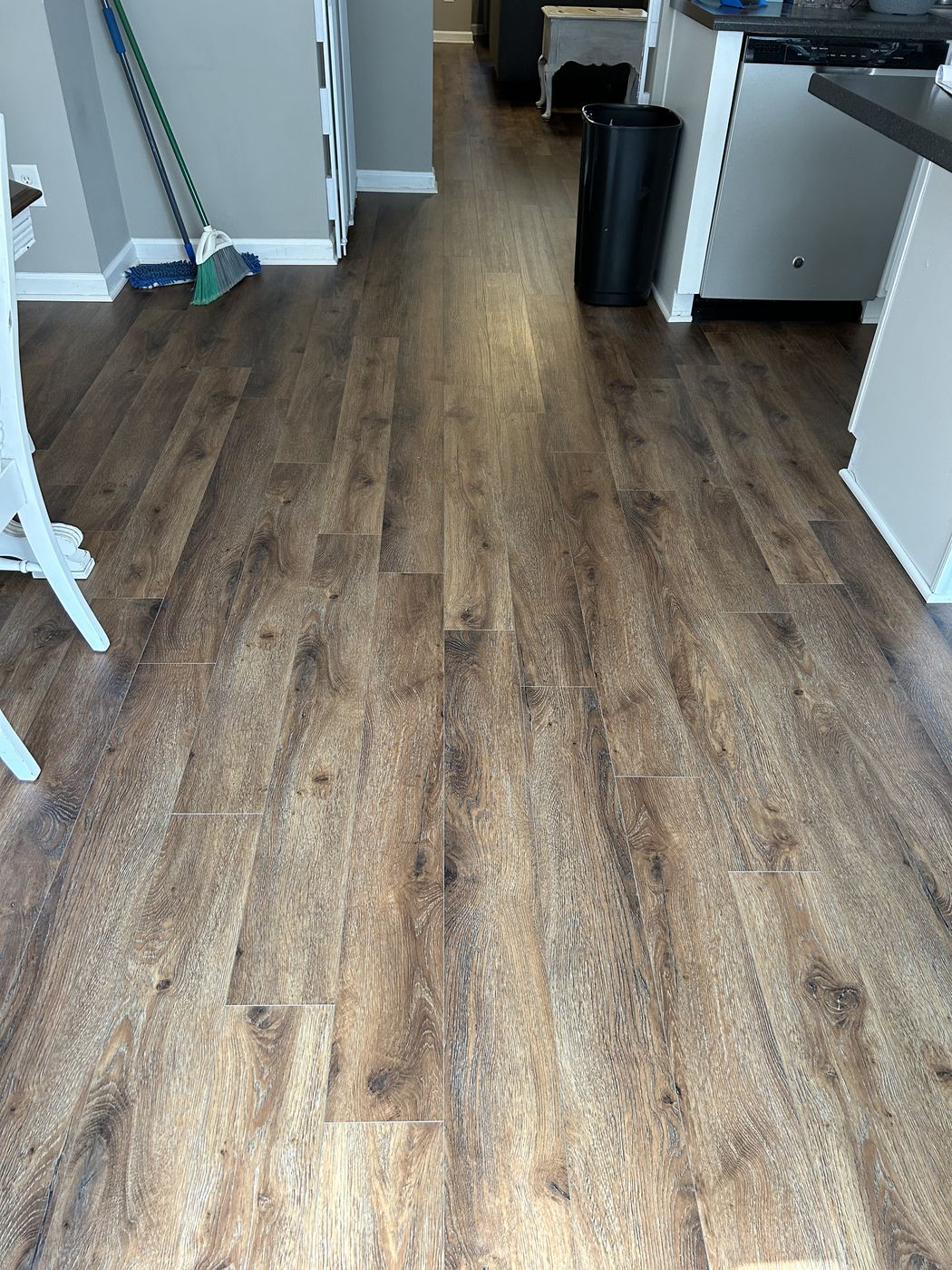 Luxury vinyl plank in a long run through a kitchen