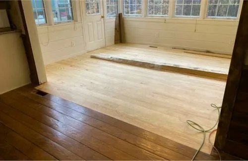 Sunroom floor mid-sanding